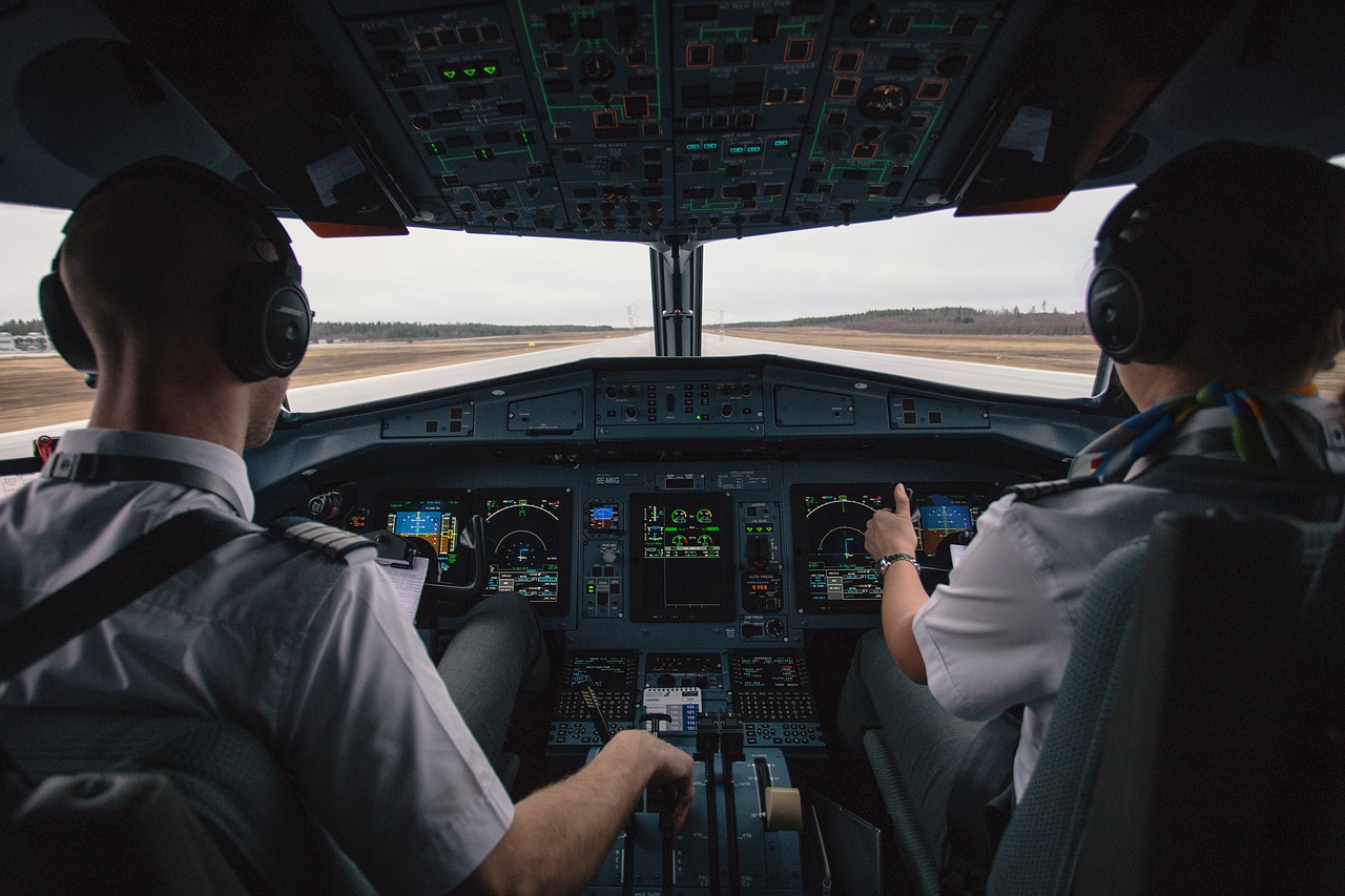 Pilots in Airplane Cockpit