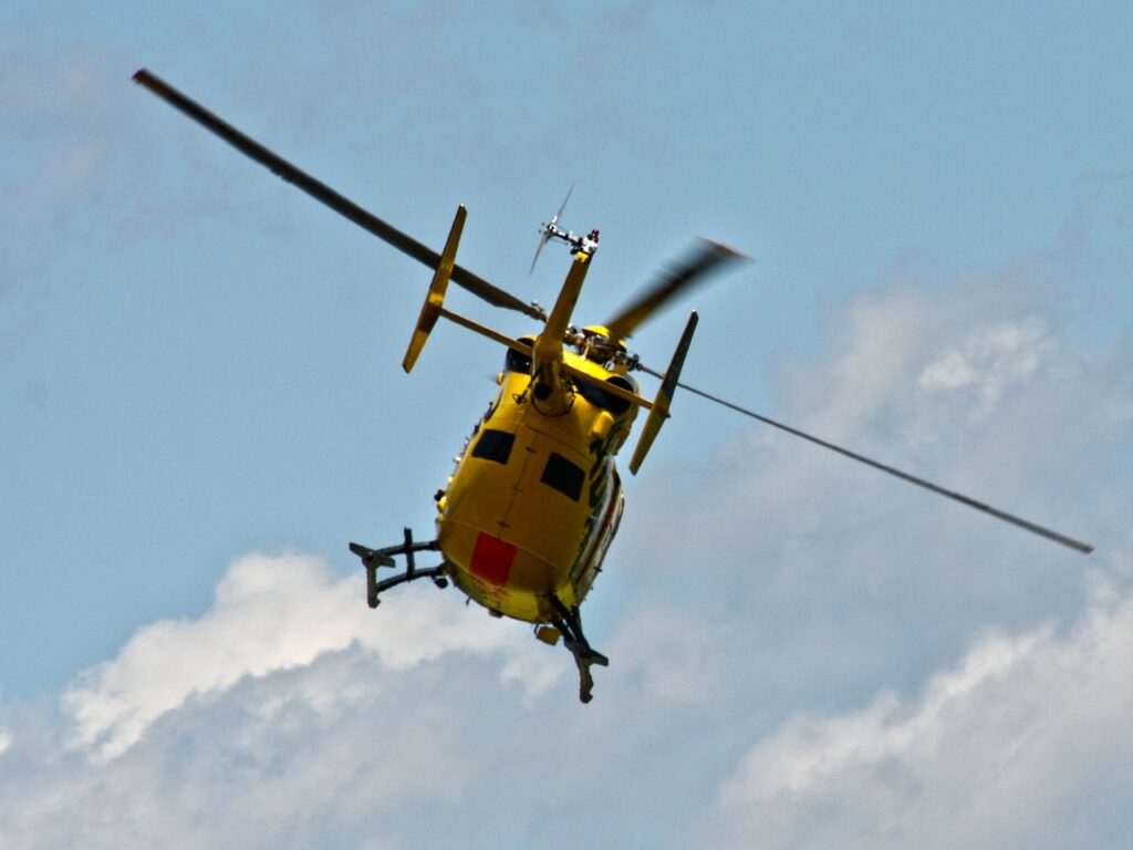 Yellow helicopter in air