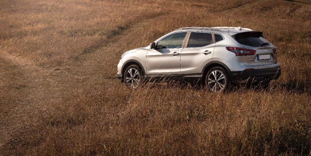 SUV driving in a field