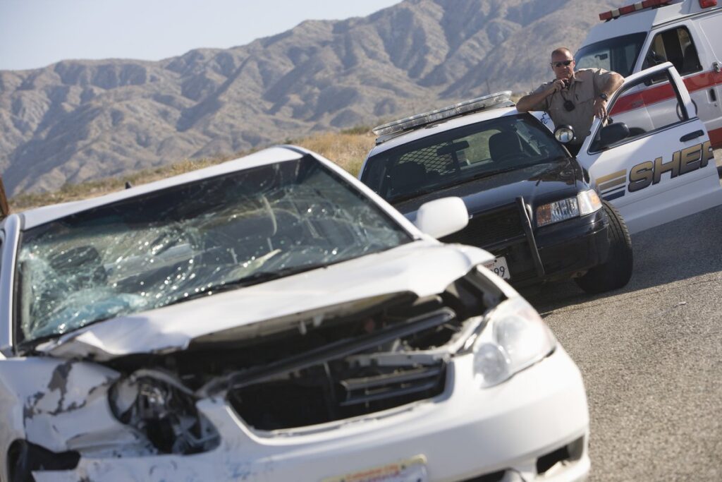 Car accident with cops and cop cars surrounding the area