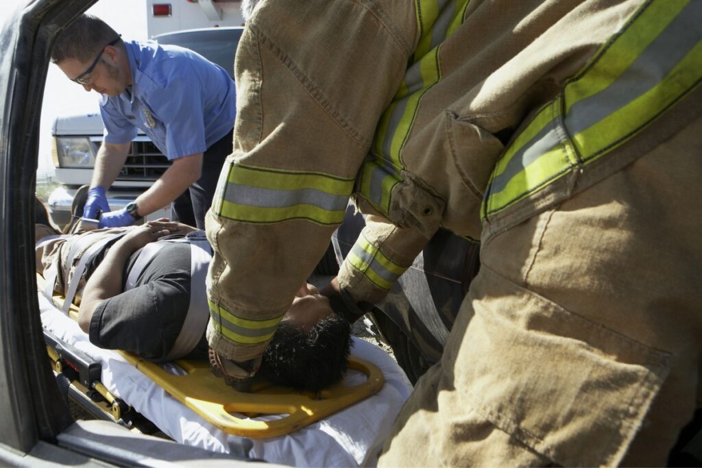 First responder with person on stretcher