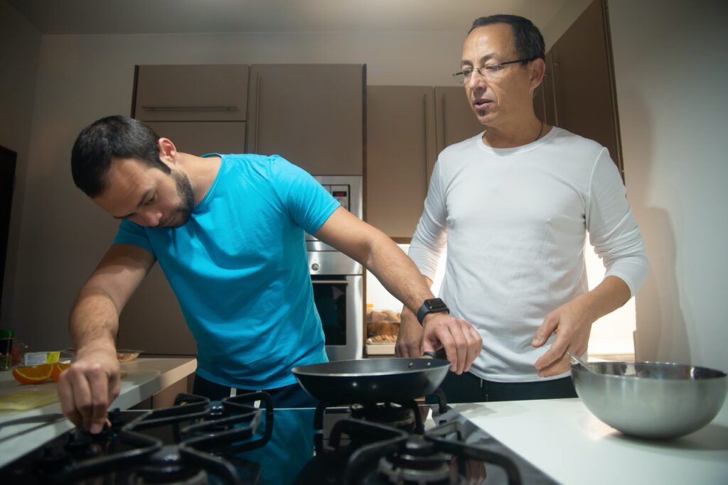 Man fixing gas stovetop