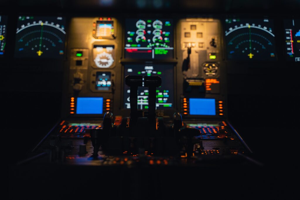 close up of the front control panel of an airplane 