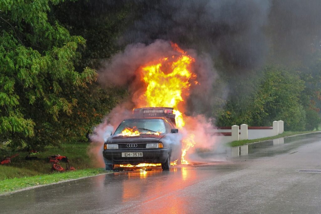 Car on fire in road