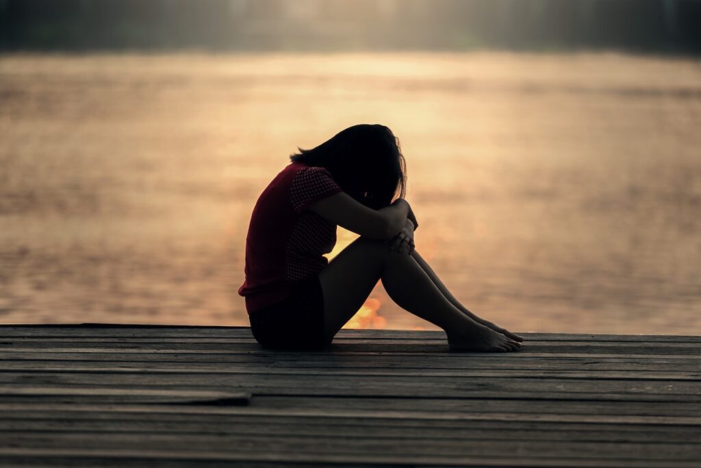 Sad girl on pier